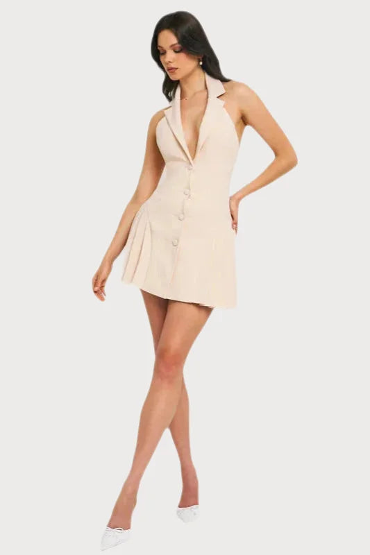 Short, pale pink sleeveless dress with a plunging neckline