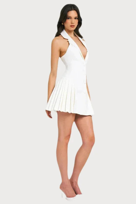 White halter-neck mini dress with a plunging neckline and pleated skirt