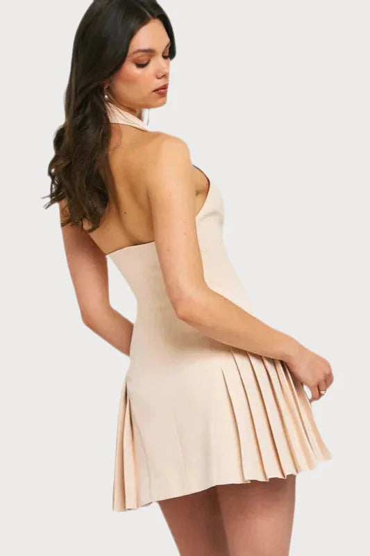 Strapless cream-colored mini dress with a pleated skirt